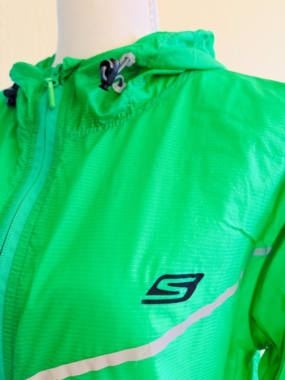 Lightweight & Fun Neon Green Skechers Performance zip-up windbreaker